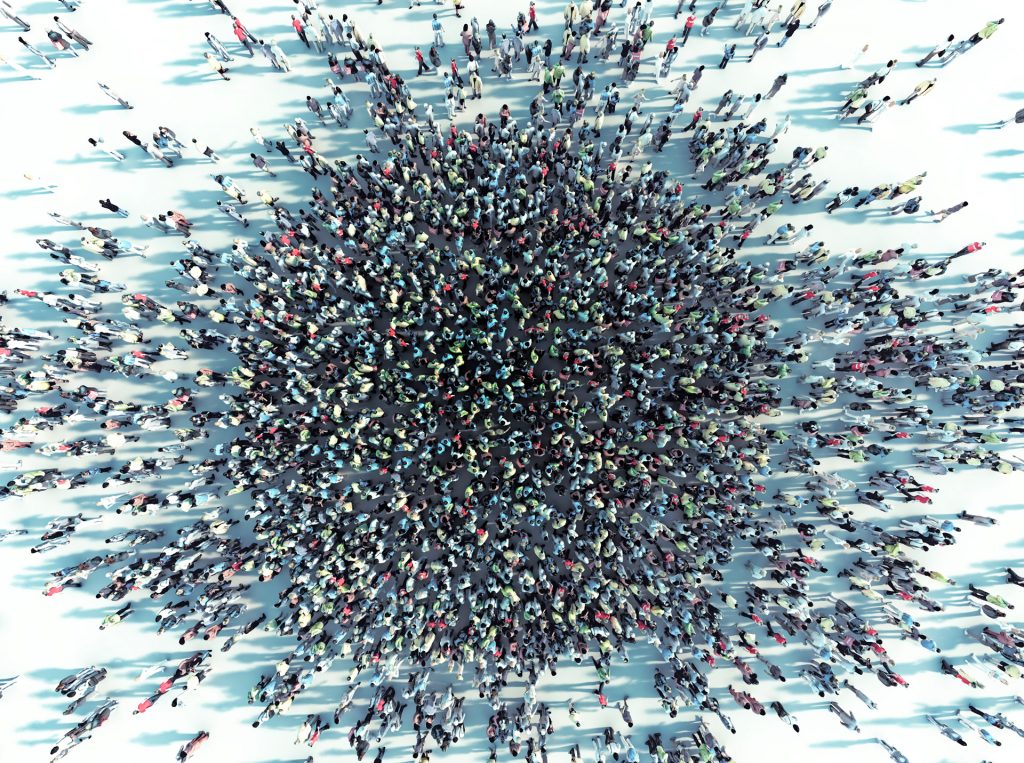 Sustainability: Driving system change - image of a large gathering crowd of people